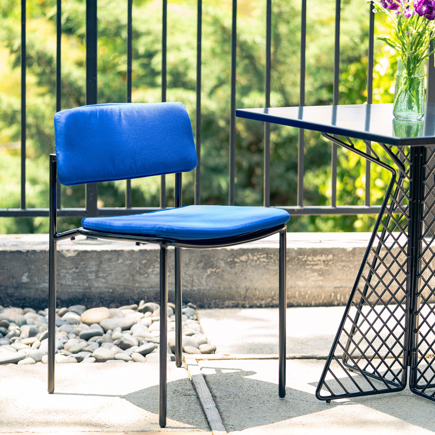 Rachel Chair shown in Black with True Blue Sunbrella Seat Padding