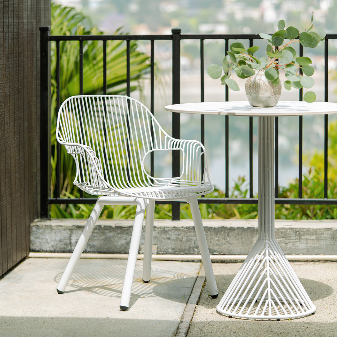 Rita Chair shown in White along side the 30" Bistro Table