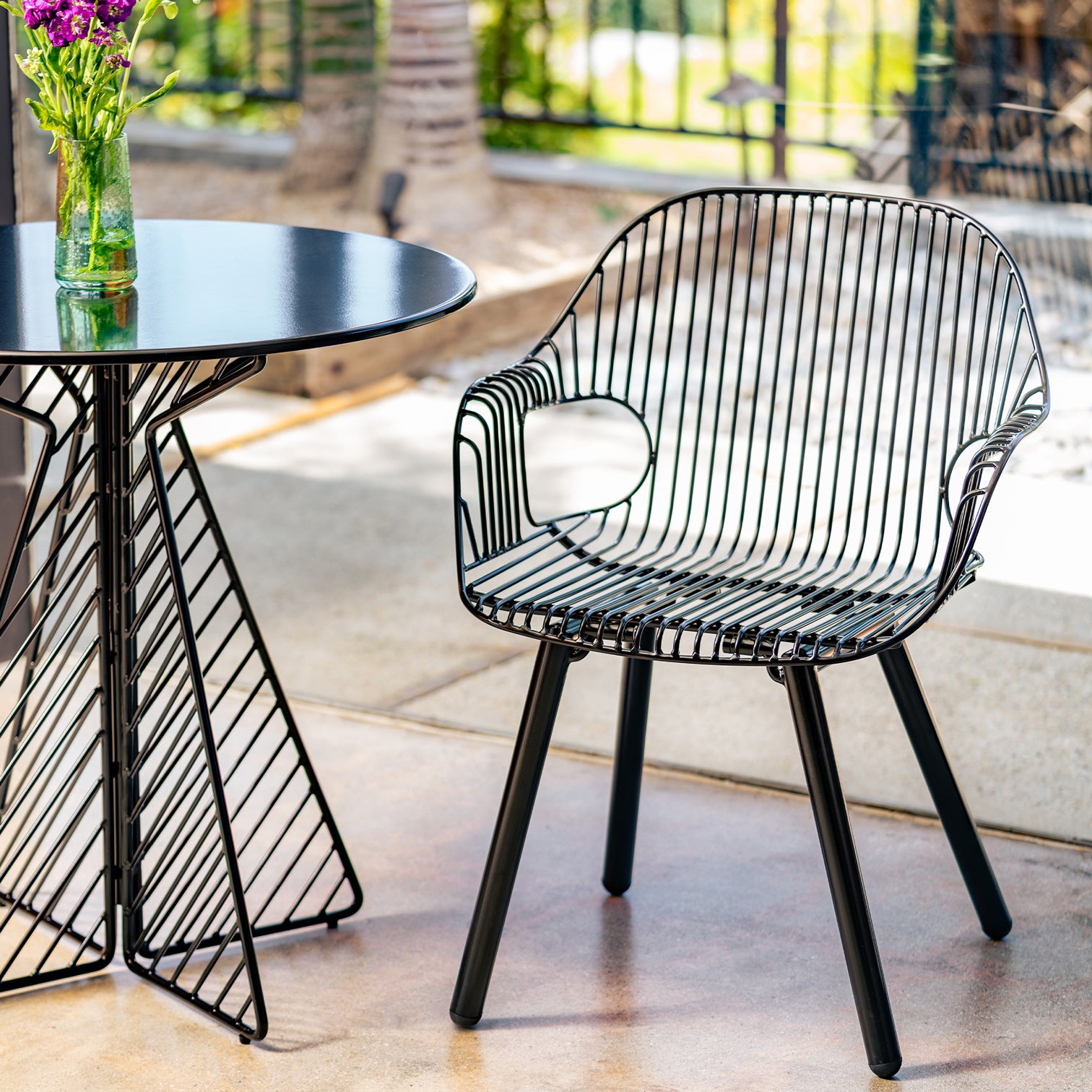 Rita Arm Chair shown in Black with Cafe Table
