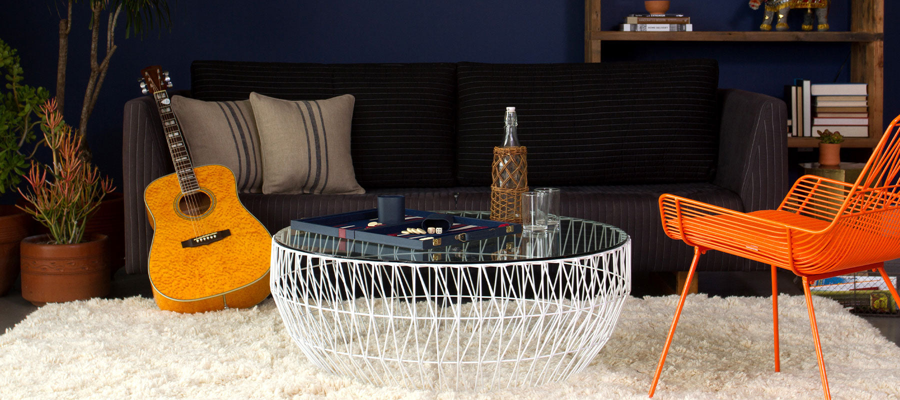 Coffee Table shown in White with Glass Top. Pictured in interior space alongside the Farmhouse Lounge.