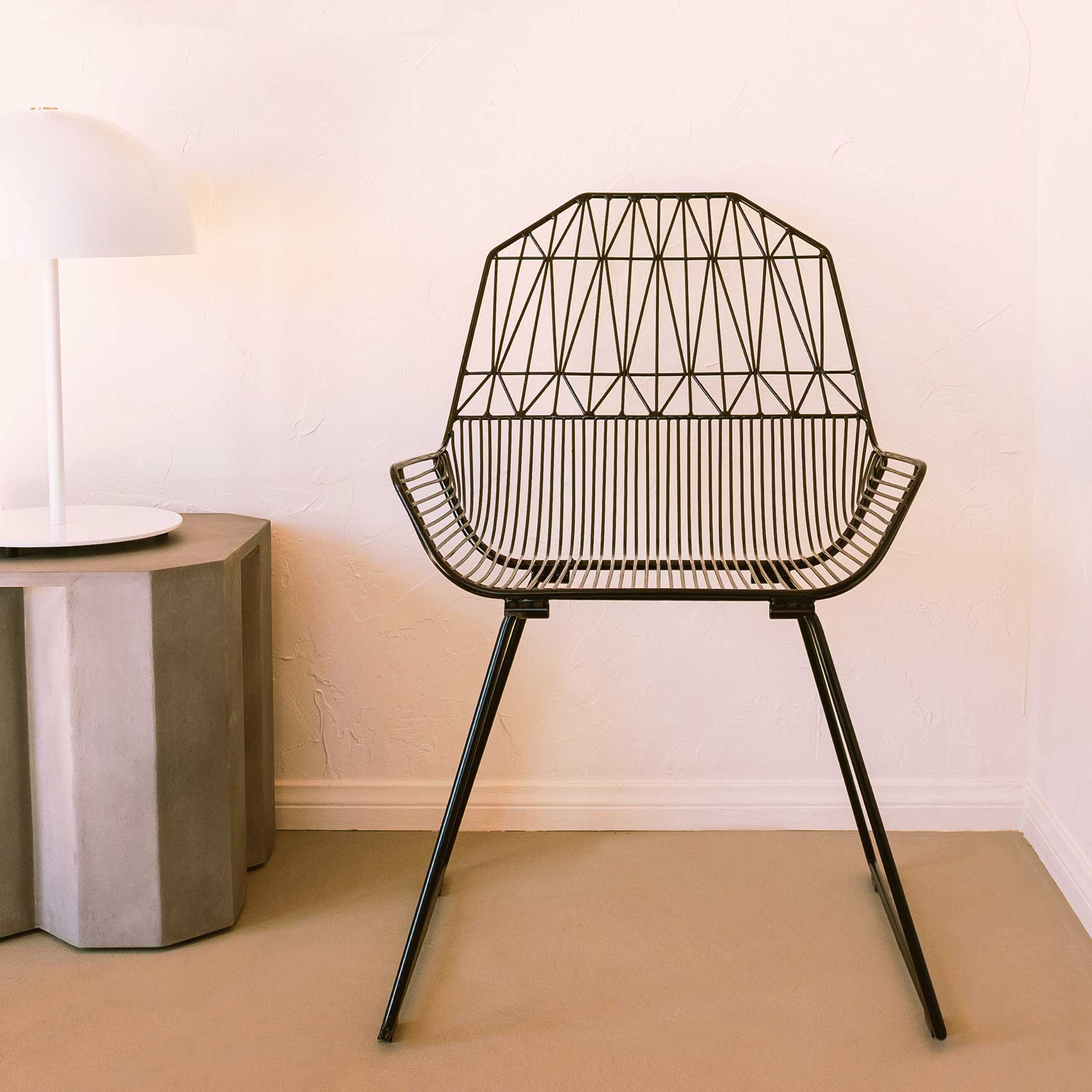 Farmhouse Lounge Chair shown in Black. Pictured in Joshua Tree interior of Home