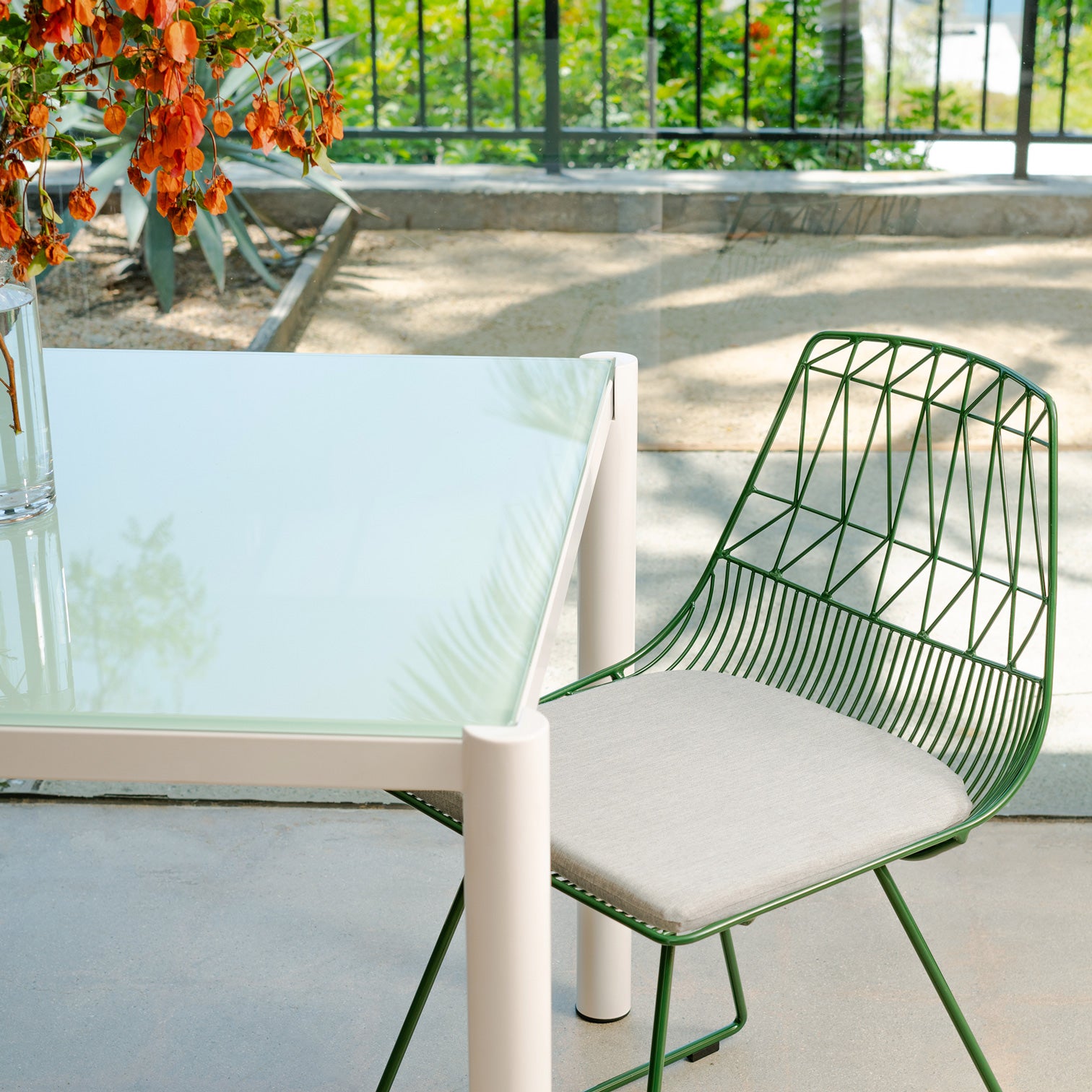 Get-Together Table pictured near Lucy Side Chair in interior space.