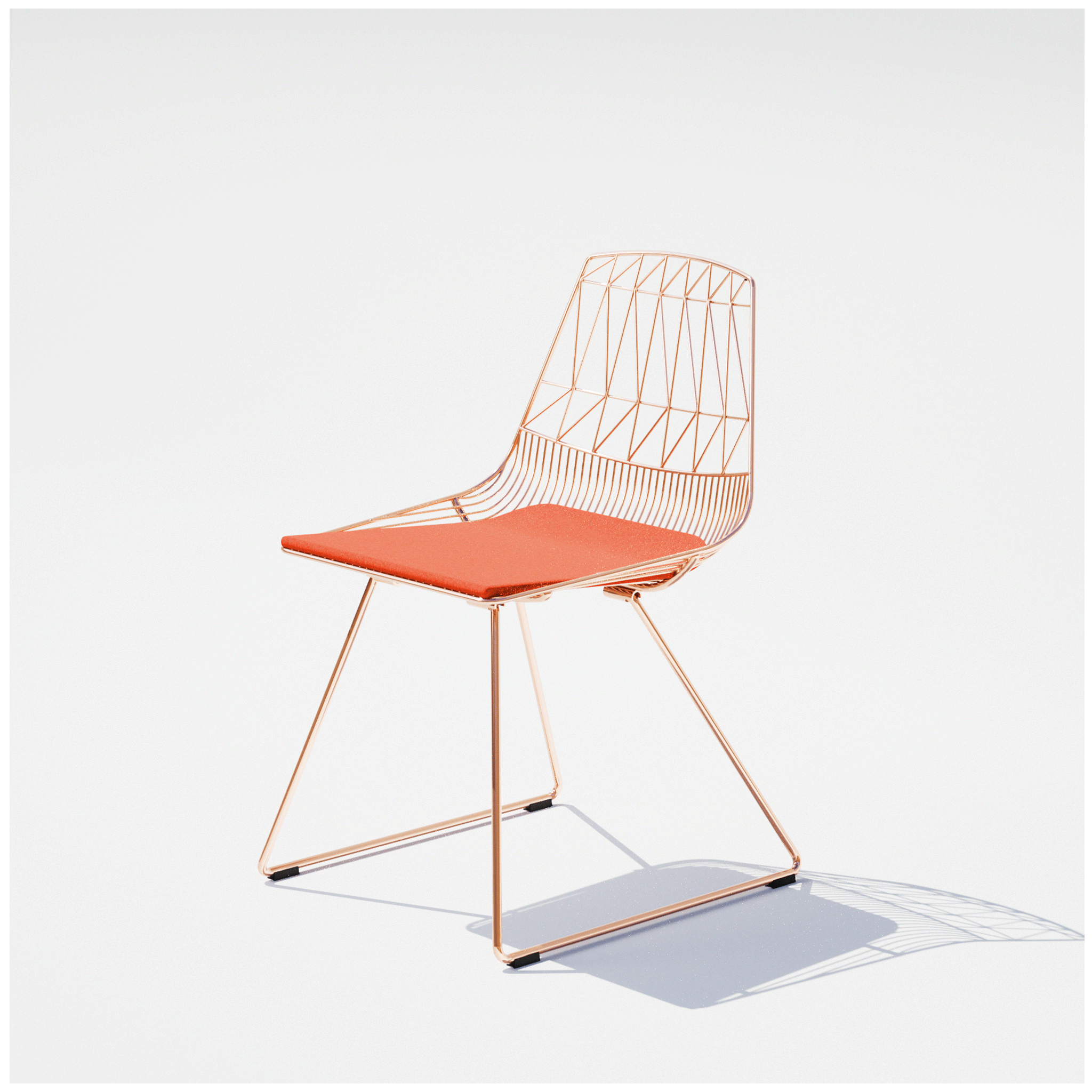Outdoor Tube Lounge Chair in Rose Gold with Orange Sunbrella cushion for extra comfort by Bend Goods