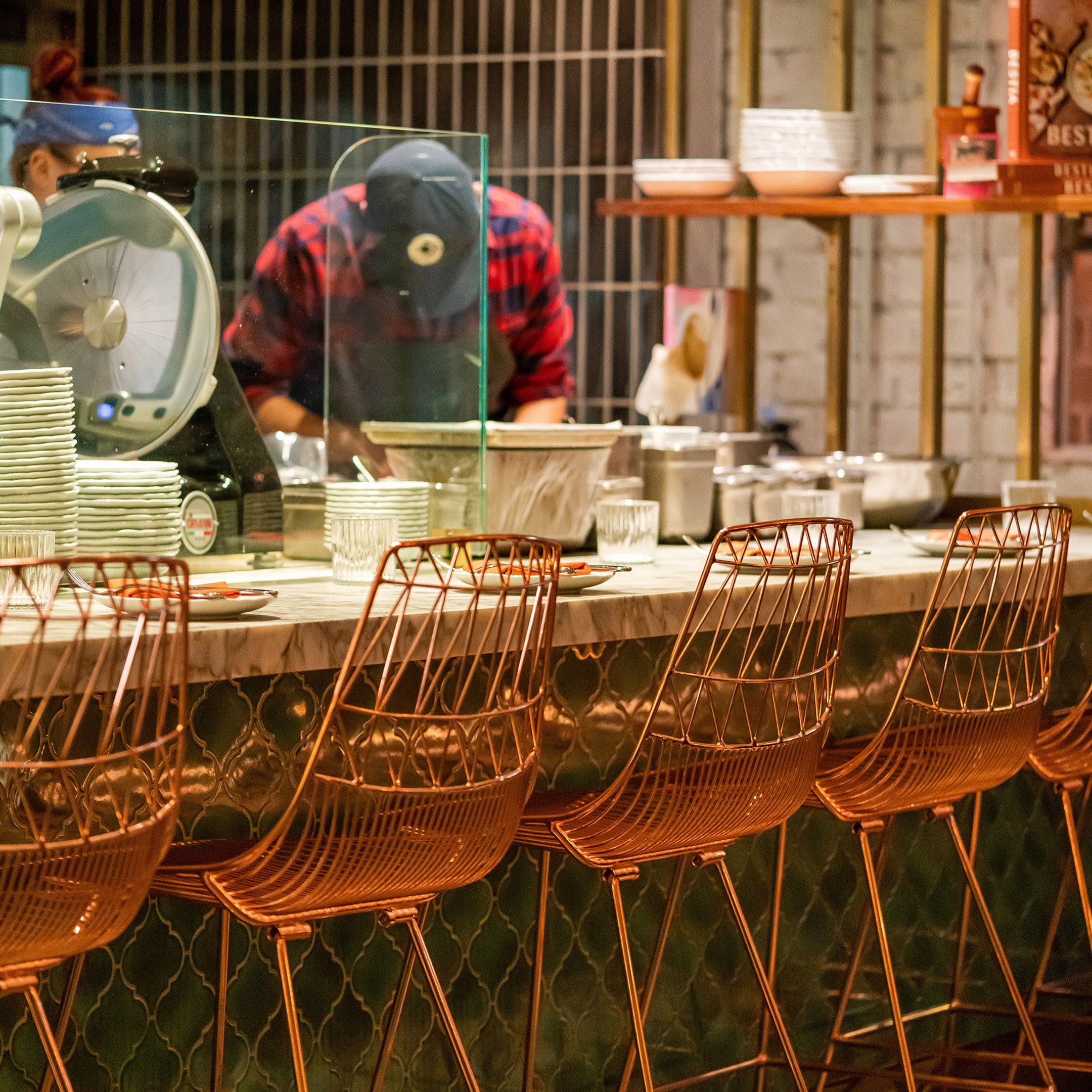 Lucy Bar Stools in Copper pictured at Bavel Restaurant in Los Angeles, CA.