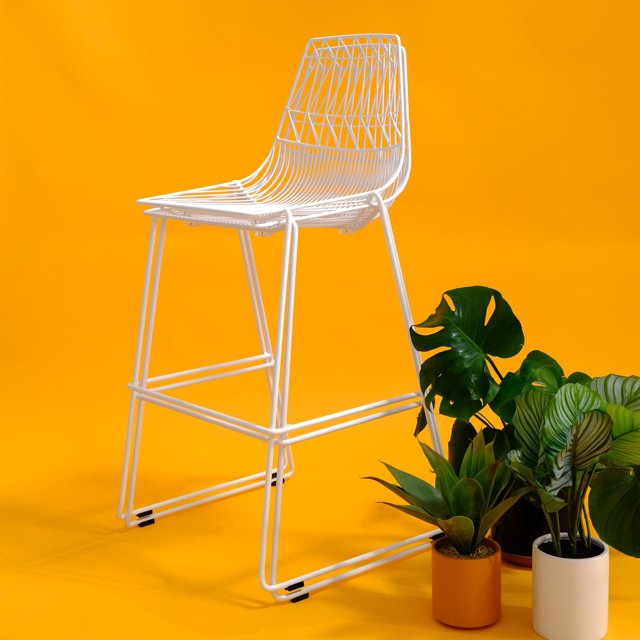 Stacking Lucy Barstools shown stacked in White