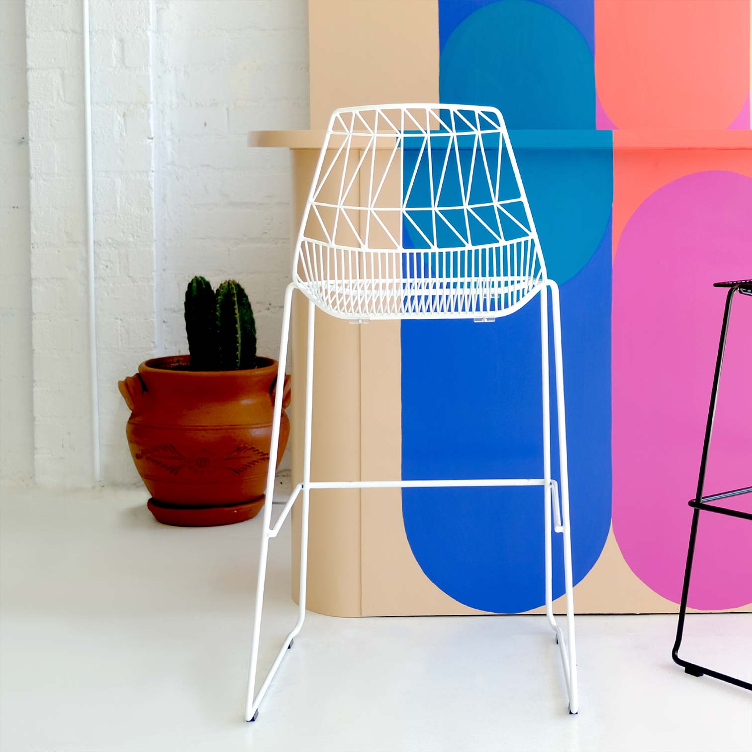 Rear view of the design of the Stacking Lucy Stool in White