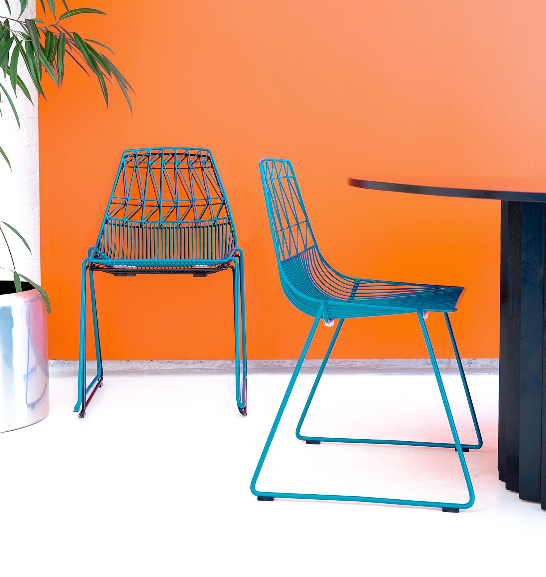 Stacking Lucy Chair shown in Peacock Blue