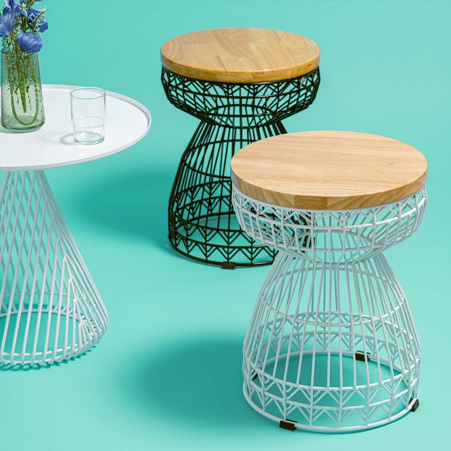Sweet Stools shown in White and Black near a Cono Table in White.