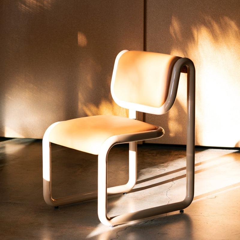 Tube Dining Chair shown in Tan powder coated finish with Tan Vegan Leather Seat and Backrest.
