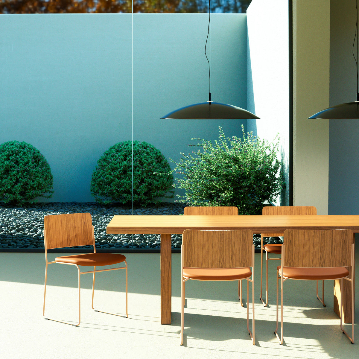 Natural ash Hinoki dining table with wood-backed chairs beside a large window, under black pendant lights.