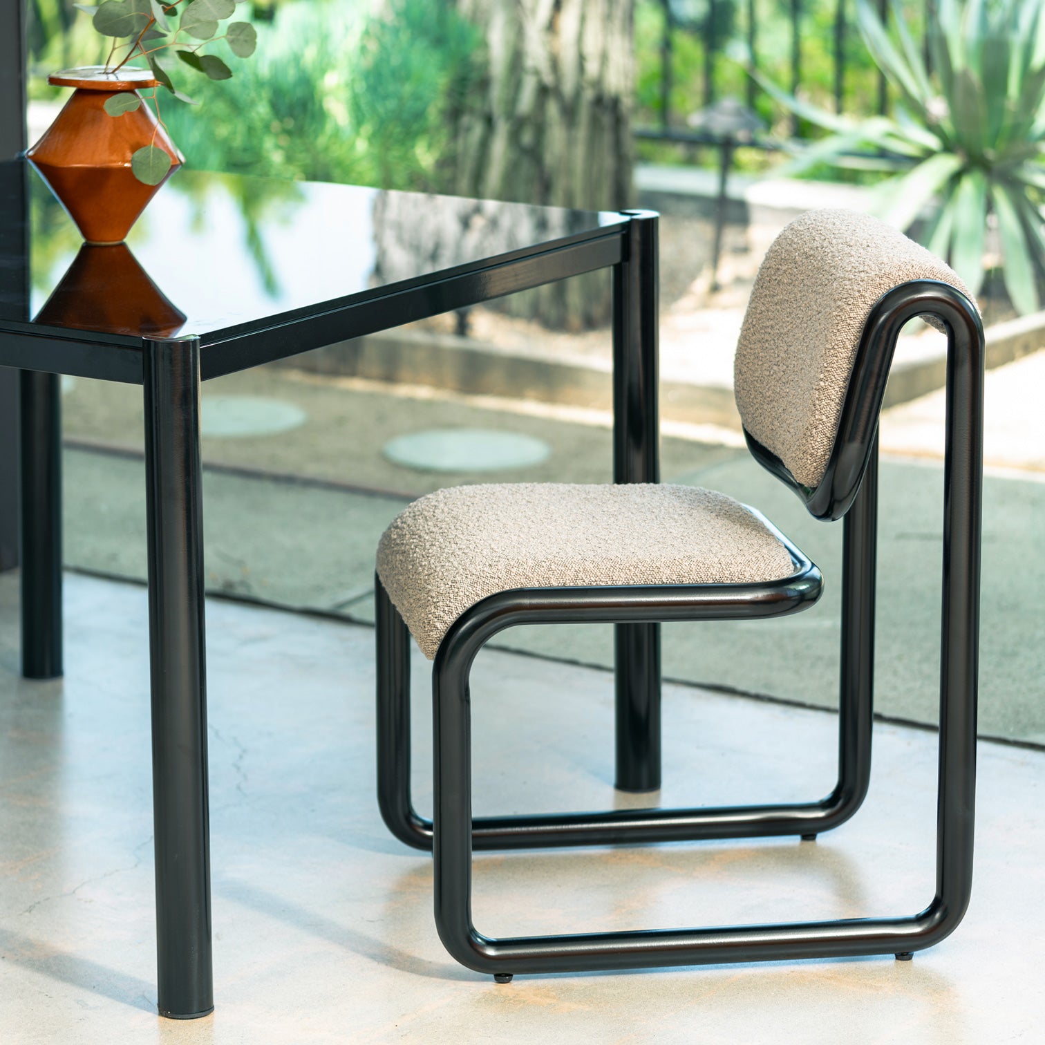 Tube Dining Chair in shown in Black with Grey Boucle
