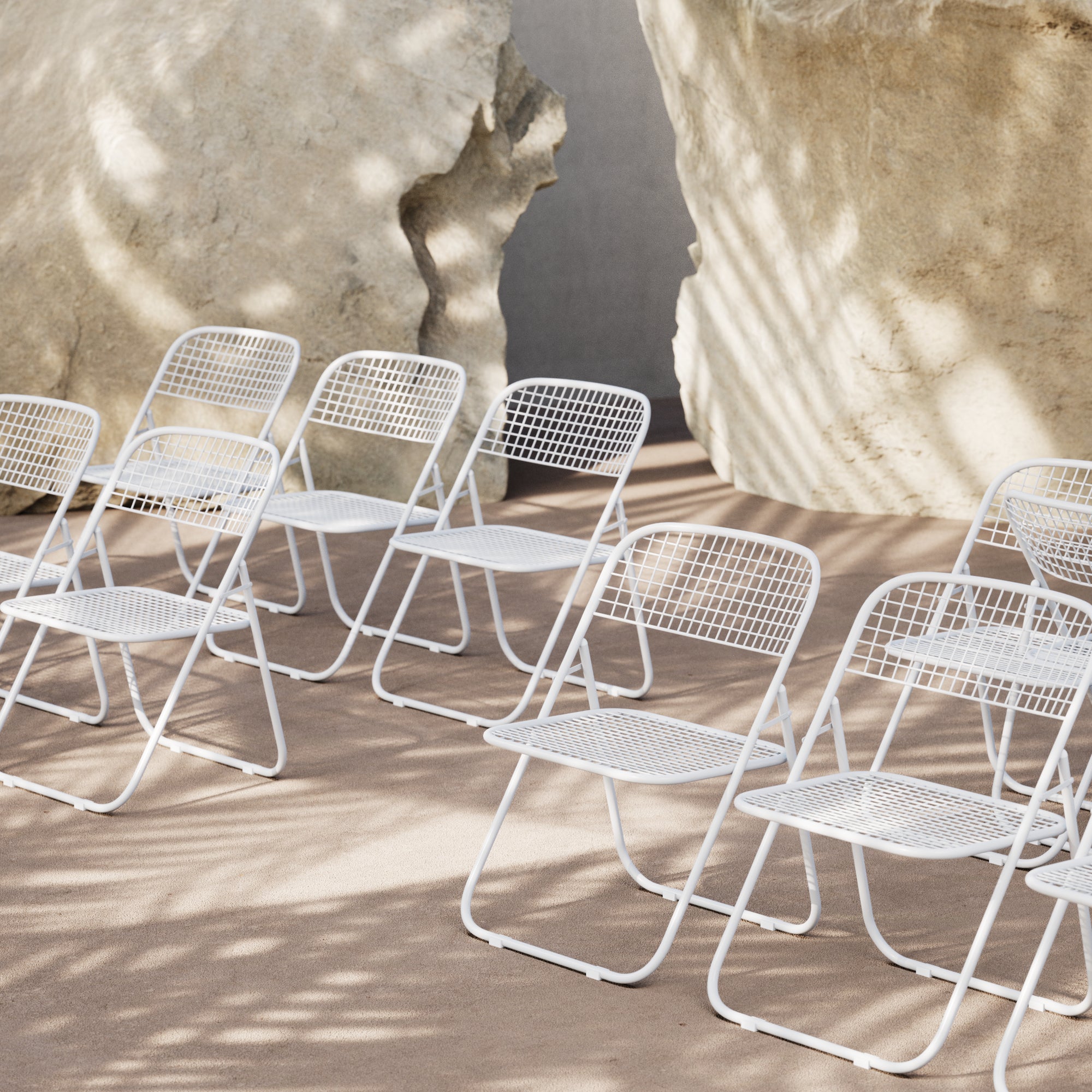 Bend Goods Fred- Folding wire dining chair with sculptural open-frame design, space-saving and lightweight for modern indoor or outdoor settings.