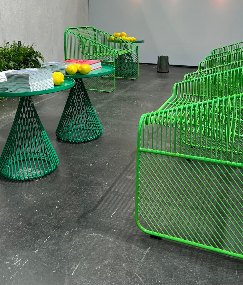 Detail of powder-coated finish on hot seat lounge chair and the cono side table built for durability and daily use.