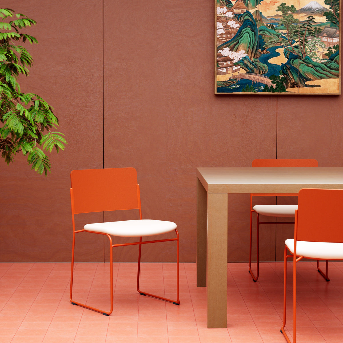 Red Hinoki dining chair with a white seat cushion beside a wood table against a red wall.