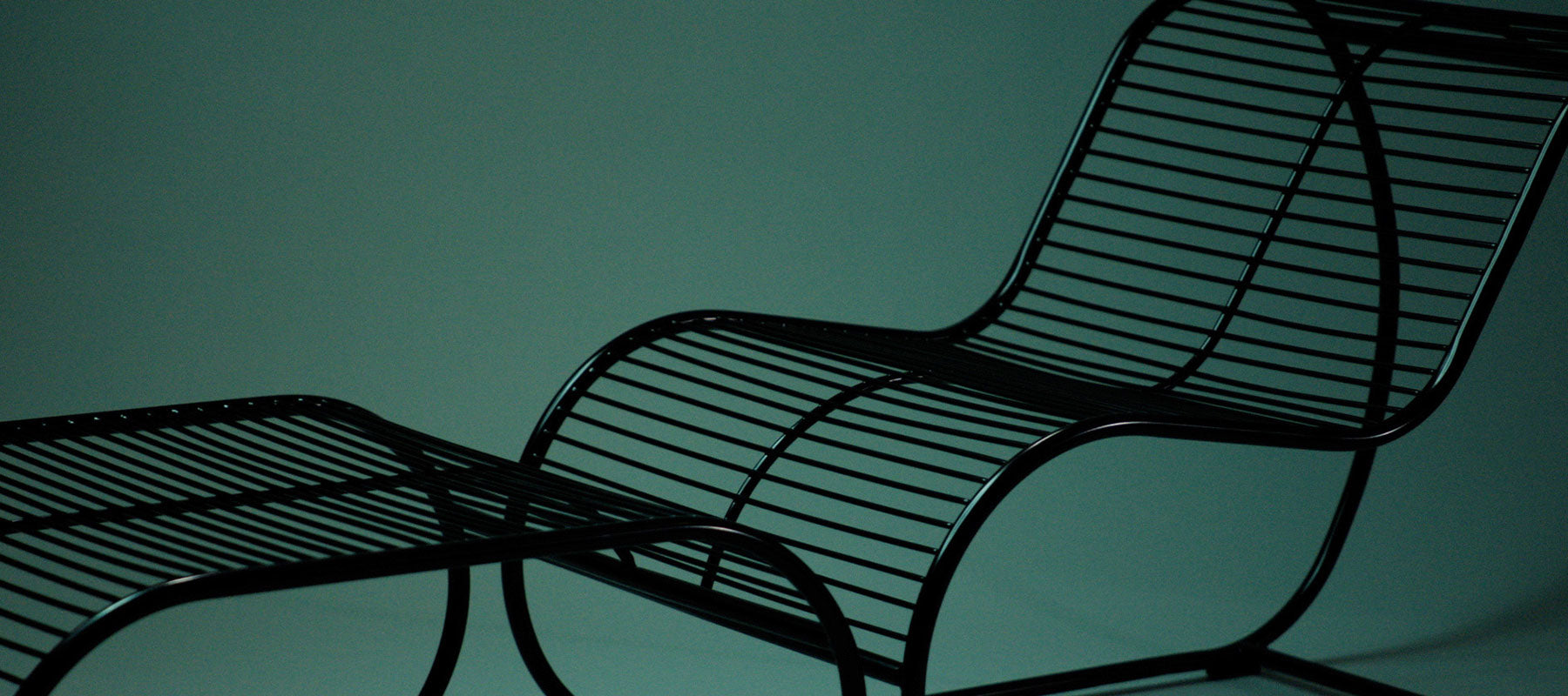 Close up of Loop Lounge Chair and Ottoman shown in Black