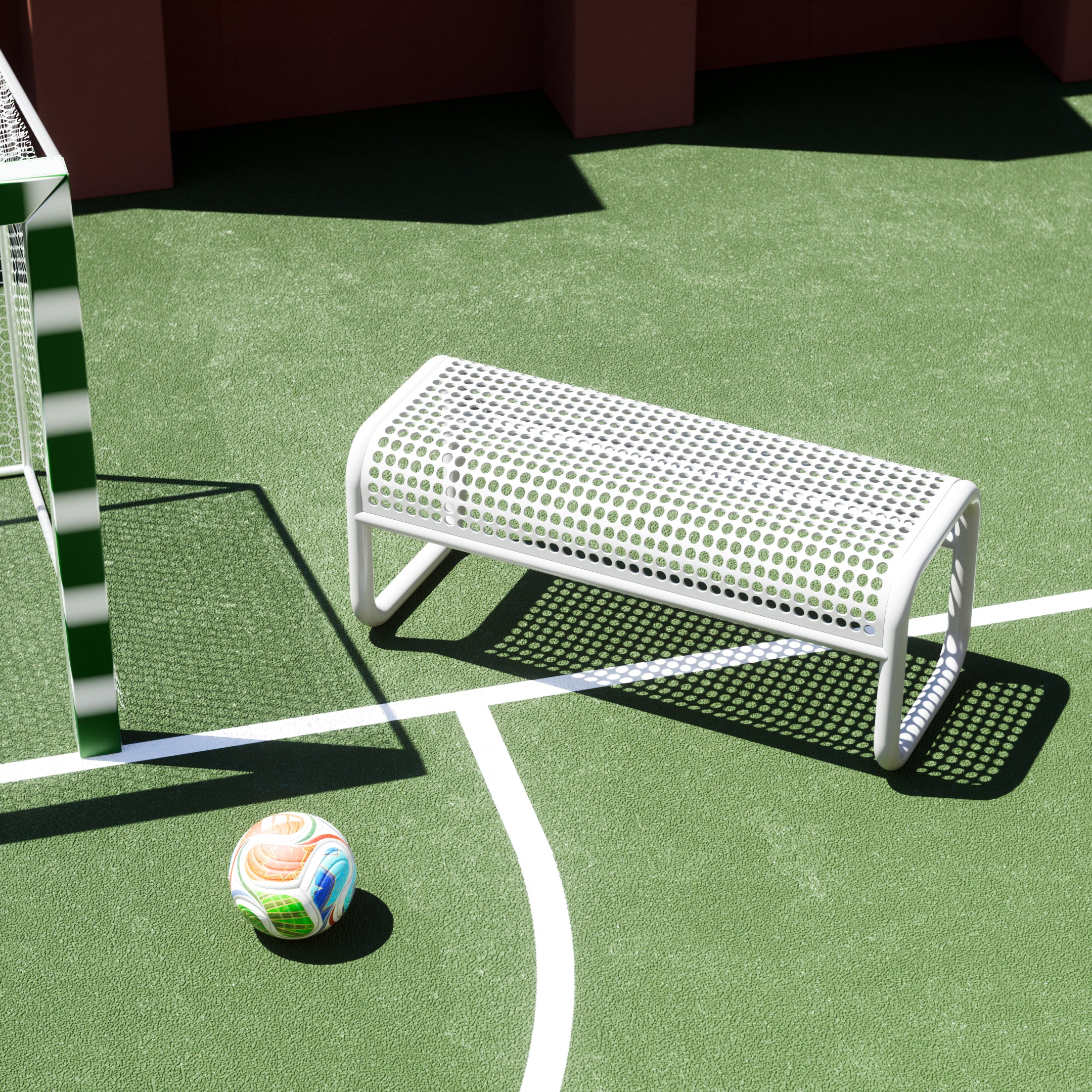 Bend Goods Tube Bench at a soccer stadium field, contemporary outdoor furniture for football fans, parks, and gathering spaces.