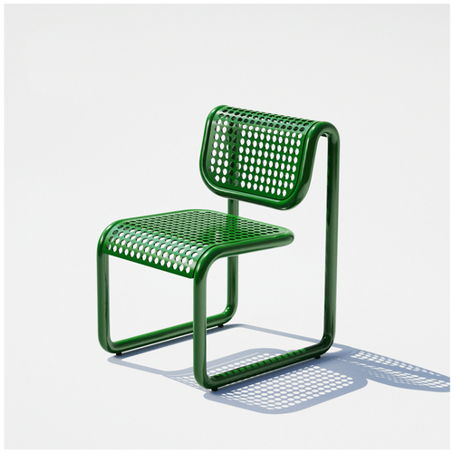 Bend Goods green perforated metal outdoor chair with tubular steel frame.