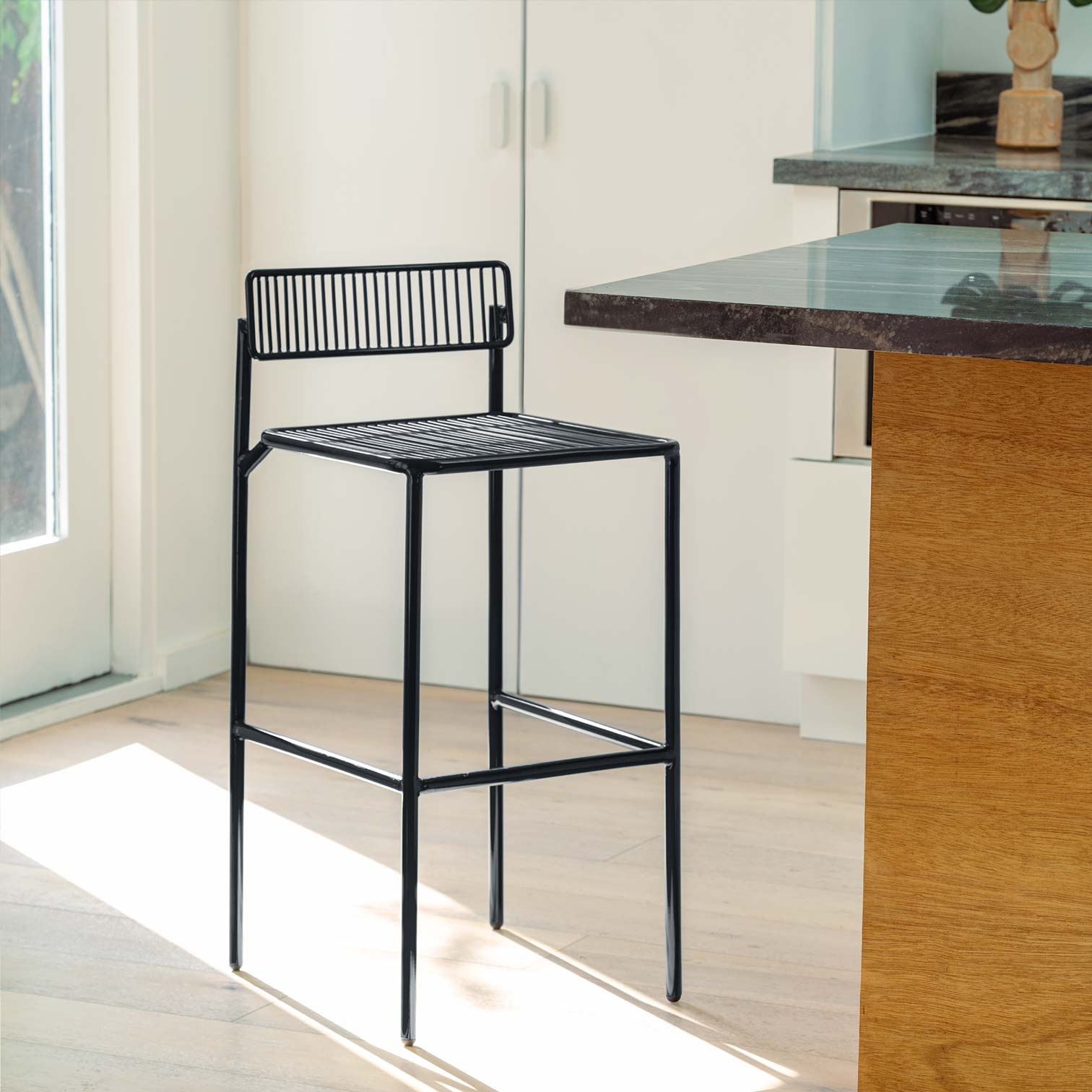 Rachel Counter Stool shown in Black in Kitchen Counter Top area.
