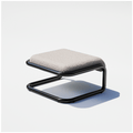 Tube Ottoman with a black tubular sled frame and a gray padded top, three-quarter view.