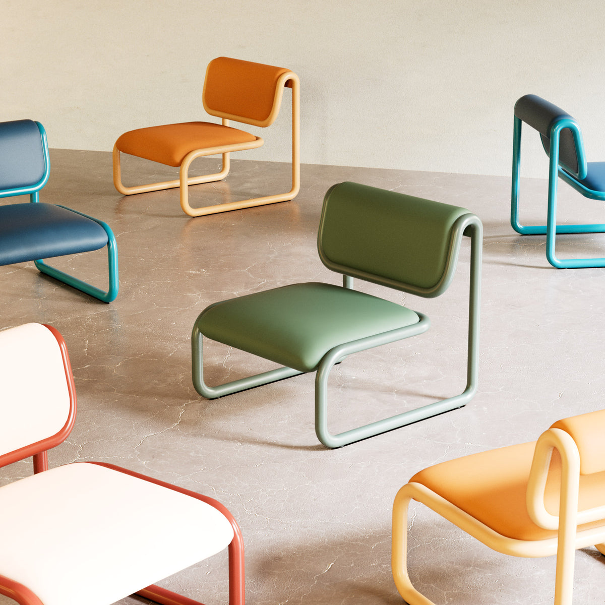 Tube Lounge 2.0 chairs in Olive, Tan, Peacock Blue and Terracotta arranged on a concrete floor.