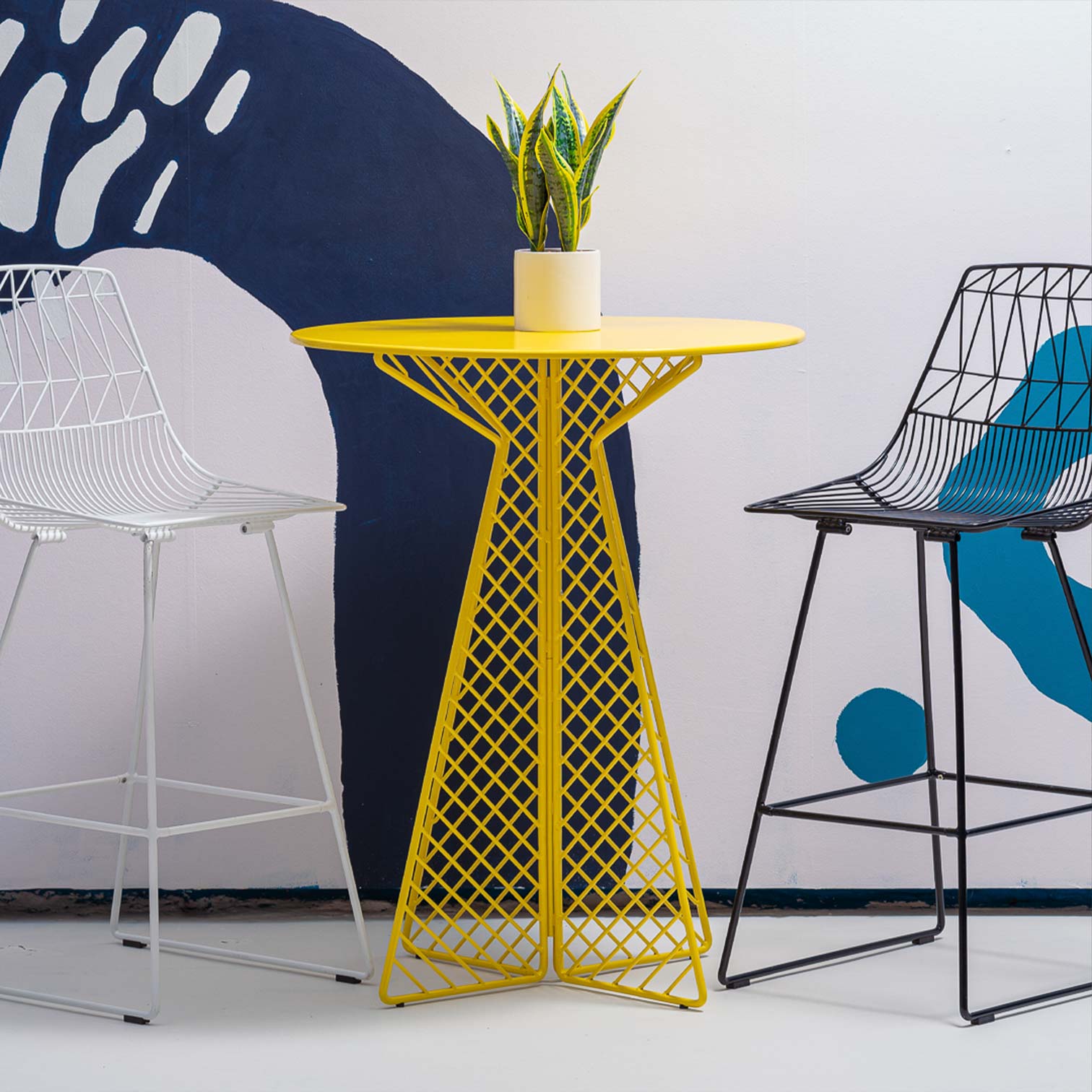 Cafe Bar Table shown in Yellow. Pictured with Lucy Barstools